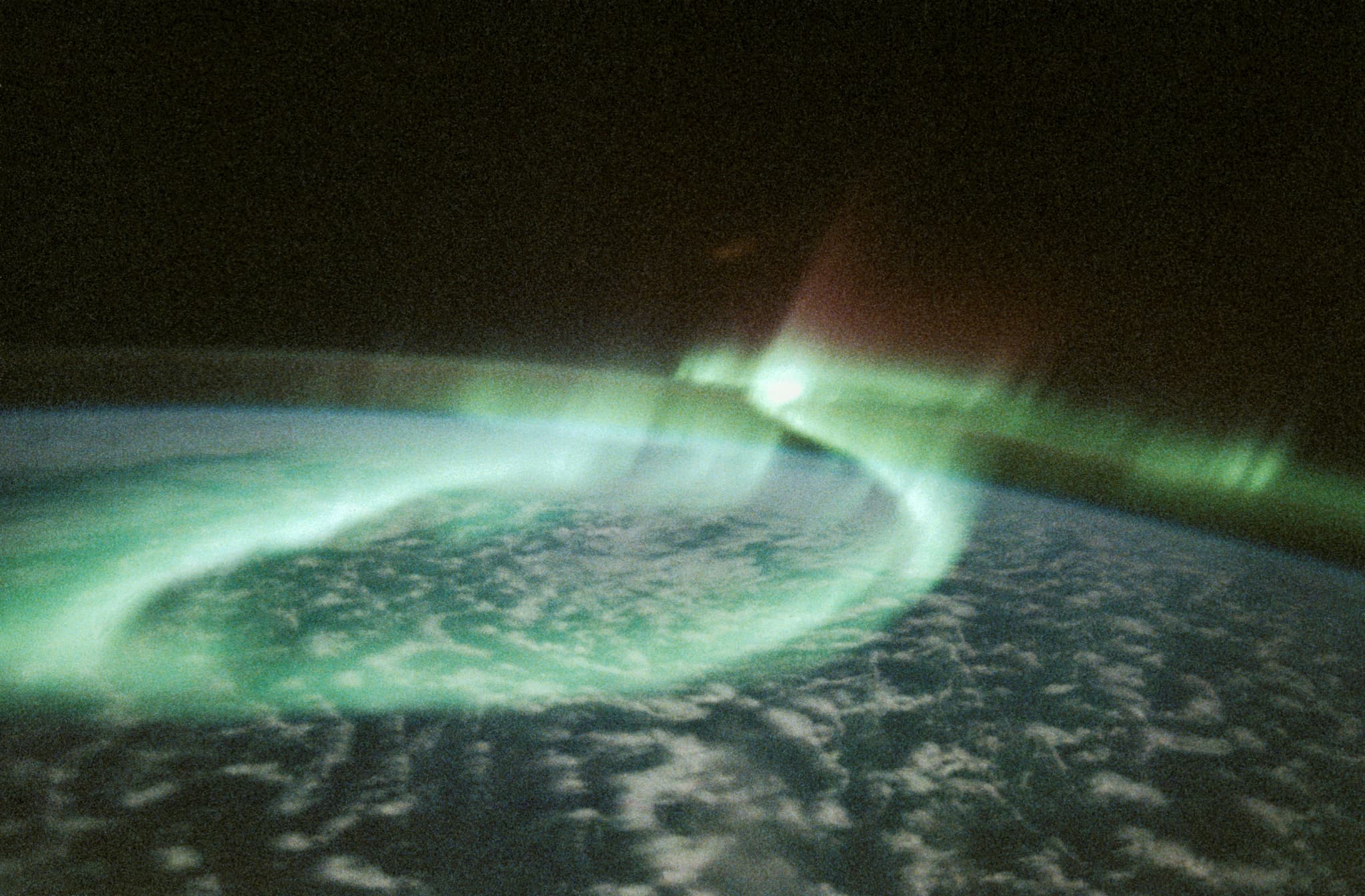 #4 Aurora Australis — Sinuous Loop — Home, Seen From Above: Earth's Most Breathtaking Views from Space