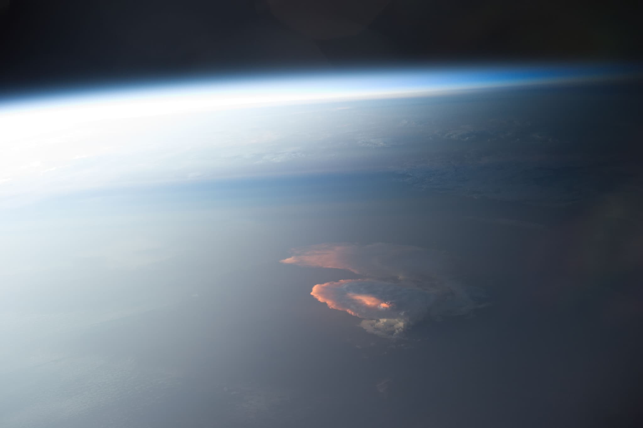 #7 Expedition 40 — Sun Highlights a Storm From Underneath — Home, Seen From Above: Earth's Most Breathtaking Views from Space