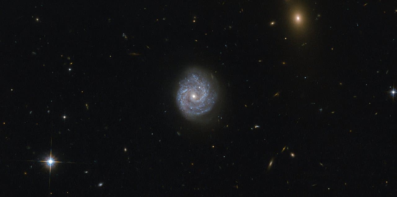 #9 Hubble Gazes into a Black Hole of Puzzling Light — Galaxy RX J1140 — Cosmic Monsters: Black Holes and the Images That Finally Revealed Them